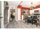 View of kitchen and breakfast nook with modern appliances and adjoining living area at 9155 Nesbit Ferry Rd, Alpharetta, GA 30022