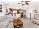 Open living room with hardwood floors and view of the kitchen at 9155 Nesbit Ferry Rd, Alpharetta, GA 30022