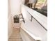 View of staircase leading to living space with decorative metal art hanging on wall at 9155 Nesbit Ferry Rd, Alpharetta, GA 30022