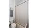 Cozy bathroom featuring a toilet with patterned flooring and a shower with a neutral curtain at 1143 Church Nw St, Atlanta, GA 30318