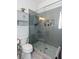 Modern bathroom featuring a glass shower with gray subway tile, decorative floor, and toilet at 1143 Church Nw St, Atlanta, GA 30318