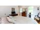Cozy bedroom featuring hardwood floors, a TV, white walls, and a comfortable bed at 1143 Church Nw St, Atlanta, GA 30318