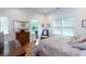 Bright bedroom with light hardwood floors, white walls, and comfortable furnishings at 1143 Church Nw St, Atlanta, GA 30318