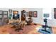 Bonus room with terra cotta floors featuring furnishings, artwork, and workout equipment at 1143 Church Nw St, Atlanta, GA 30318