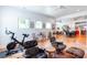 Versatile bonus space featuring workout equipment and comfortable seating area with natural light at 1143 Church Nw St, Atlanta, GA 30318