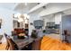 Spacious dining area with view into kitchen featuring stainless appliances and gray cabinetry at 1143 Church Nw St, Atlanta, GA 30318