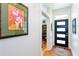 Clean entryway with a black-framed glass door, hardwood floors, and bright, white walls perfect for art display at 1143 Church Nw St, Atlanta, GA 30318