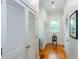 Hallway with hardwood floors, and white-slatted doors adding depth and dimension at 1143 Church Nw St, Atlanta, GA 30318