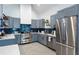 Well-equipped kitchen with grey cabinets, stainless steel appliances, and modern tile backsplash at 1143 Church Nw St, Atlanta, GA 30318