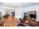 Open-concept living space with terra cotta tile, modern furnishings, and ample natural light at 1143 Church Nw St, Atlanta, GA 30318