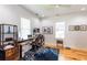 Bright home office with hardwood floors, white walls, and natural light from multiple windows at 1143 Church Nw St, Atlanta, GA 30318