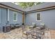 Charming outdoor patio area with a comfortable seating arrangement, perfect for relaxation and entertaining guests at 1143 Church Nw St, Atlanta, GA 30318