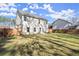 Spacious backyard featuring a well-maintained lawn, patio, and privacy fence at 1511 Arica Ave, Lawrenceville, GA 30043