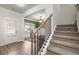 Inviting entryway with hardwood floors and staircase at 1511 Arica Ave, Lawrenceville, GA 30043