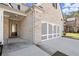 Beautiful home with a brick facade, covered entry, and a gray garage door at 1511 Arica Ave, Lawrenceville, GA 30043