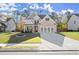 Beautiful two-story home with a well-manicured lawn, modern garage door, and inviting curb appeal at 1511 Arica Ave, Lawrenceville, GA 30043