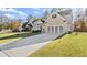 Lovely home featuring a well-kept lawn and modern garage door with gray accents at 1511 Arica Ave, Lawrenceville, GA 30043