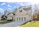 Charming home with a well-kept lawn and a modern garage door with gray accents at 1511 Arica Ave, Lawrenceville, GA 30043