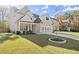 Charming home showcasing manicured lawn and modern gray garage door at 1511 Arica Ave, Lawrenceville, GA 30043