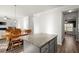 Kitchen area with granite island table and chairs with views to the living area at 1511 Arica Ave, Lawrenceville, GA 30043