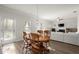 Kitchen dining area features a wooden table set and connects to the living room, creating an inviting space at 1511 Arica Ave, Lawrenceville, GA 30043