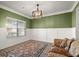 Living room featuring wainscoting and hardwood floors at 1511 Arica Ave, Lawrenceville, GA 30043