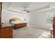 Spacious main bedroom features a tray ceiling, windows, and neutral paint at 1511 Arica Ave, Lawrenceville, GA 30043