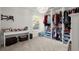 A walk-in closet with a built-in organizer and adjacent desk at 1511 Arica Ave, Lawrenceville, GA 30043