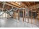 Unfinished basement space with exposed ceiling beams and concrete floors, ready to be customized at 3204 Robin Rd, Decatur, GA 30032
