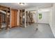 Unfinished basement with grey concrete floor and white walls, ready to be remodeled and finished at 3204 Robin Rd, Decatur, GA 30032