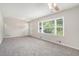 Bright living room with plush new carpet and large windows, offering ample natural light at 3204 Robin Rd, Decatur, GA 30032