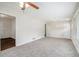 Sunlit living room featuring fresh paint, new carpet, and large windows at 3204 Robin Rd, Decatur, GA 30032