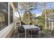 Outdoor balcony with dining table and seating for six overlooking trees at 1538 Chantilly Ne Dr # 224, Atlanta, GA 30324