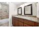 Bathroom featuring a double vanity with granite countertops and a tiled shower/tub combo at 1538 Chantilly Ne Dr # 224, Atlanta, GA 30324
