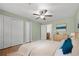 Bedroom featuring a ceiling fan, large window, ensuite bathroom, and walk-in closet at 1538 Chantilly Ne Dr # 224, Atlanta, GA 30324