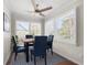Dining nook with large windows offering bright light and wooden table and blue chairs at 1538 Chantilly Ne Dr # 224, Atlanta, GA 30324