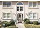 Charming condo building featuring an arched entryway, updated windows, and manicured landscaping at 1538 Chantilly Ne Dr # 224, Atlanta, GA 30324