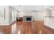 Bright living room featuring a fireplace, hardwood floors, and access to a balcony through french doors at 1538 Chantilly Ne Dr # 224, Atlanta, GA 30324