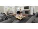 Open concept living area with sleek modern furniture and connected dining space with natural light at 1538 Chantilly Ne Dr # 224, Atlanta, GA 30324