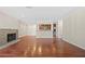 Spacious living room with hardwood floors, a fireplace, and an open view of the modern kitchen at 1538 Chantilly Ne Dr # 224, Atlanta, GA 30324