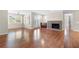 Well-lit living space featuring hardwood floors, french doors to the outside, and a cozy fireplace at 1538 Chantilly Ne Dr # 224, Atlanta, GA 30324