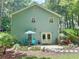 Exterior view of a two story home featuring a stone patio and a well maintained yard at 3320 Bryant Ln, Marietta, GA 30066