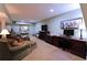 Finished basement featuring a cozy seating area and desk workspace with dark wood furnishings at 3320 Bryant Ln, Marietta, GA 30066