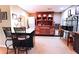 Basement bar area with wooden cabinets, sink, microwave, and seating for a comfortable entertaining space at 3320 Bryant Ln, Marietta, GA 30066