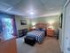 Basement bedroom with plaid bedding and a view to the patio at 3320 Bryant Ln, Marietta, GA 30066