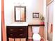 Bathroom featuring modern vanity, decorative mirror and convenient storage baskets at 3320 Bryant Ln, Marietta, GA 30066