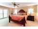 Bright bedroom featuring a decorative ceiling fan, large windows and neutral paint scheme at 3320 Bryant Ln, Marietta, GA 30066
