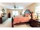 Spacious bedroom with a decorative mirror and lots of natural light from the large windows at 3320 Bryant Ln, Marietta, GA 30066