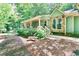Attractive home entrance with stone details, inviting porch, and meticulous landscaping at 3320 Bryant Ln, Marietta, GA 30066