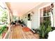 Inviting covered porch with ample seating area, plants and decor at 3320 Bryant Ln, Marietta, GA 30066